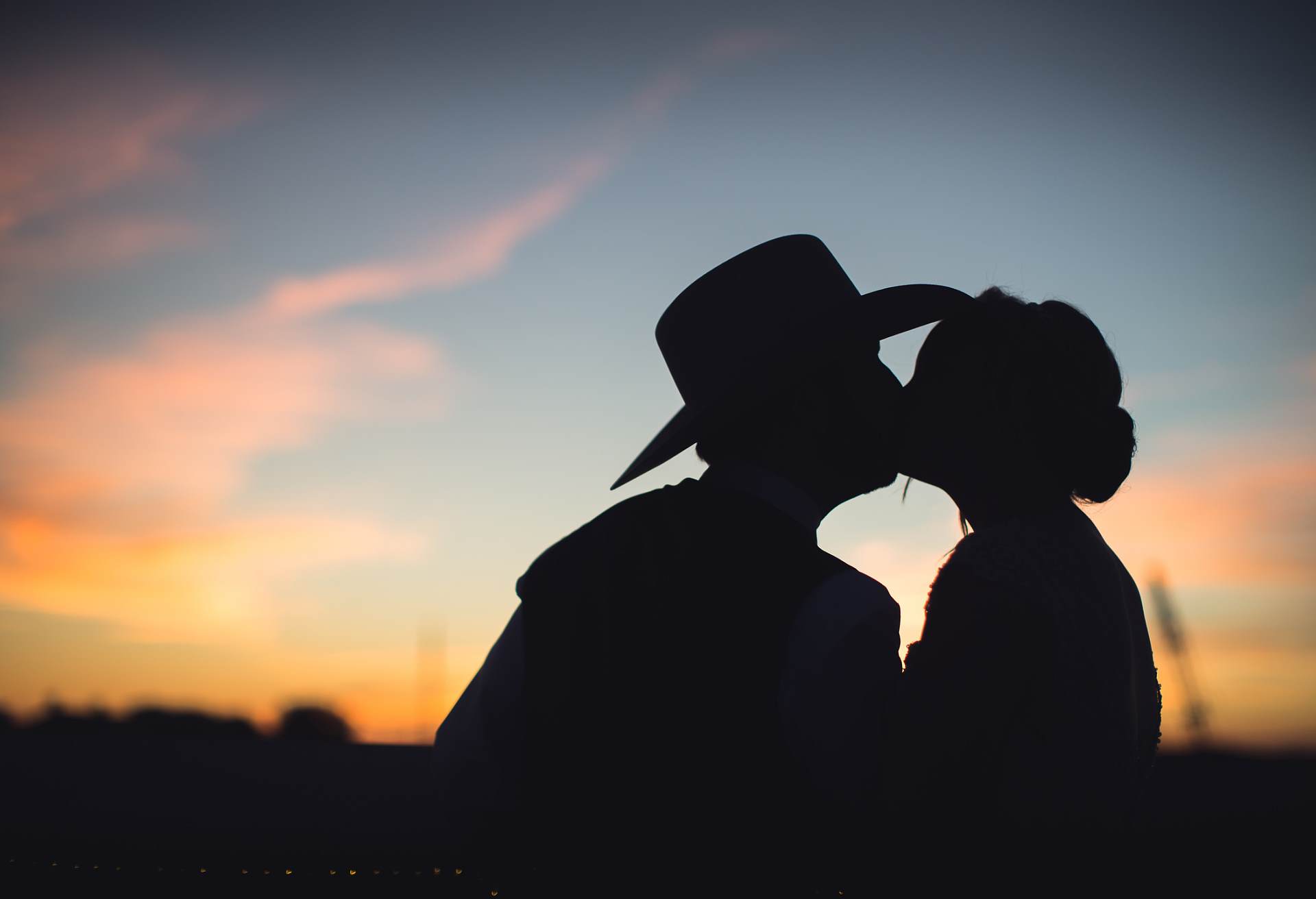 cowboyhat sunset portrait bride and groom